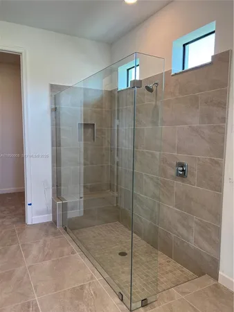 wooden floor with a bathroom