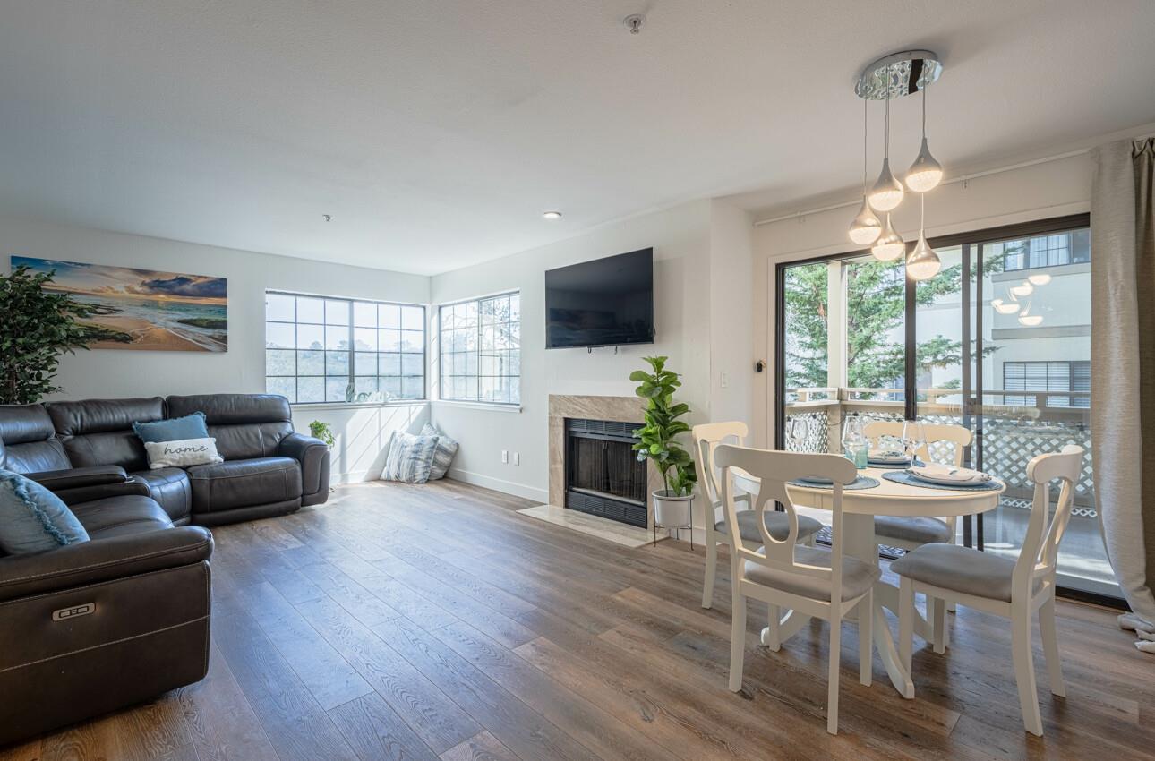 a living room with fireplace furniture and a flat screen tv