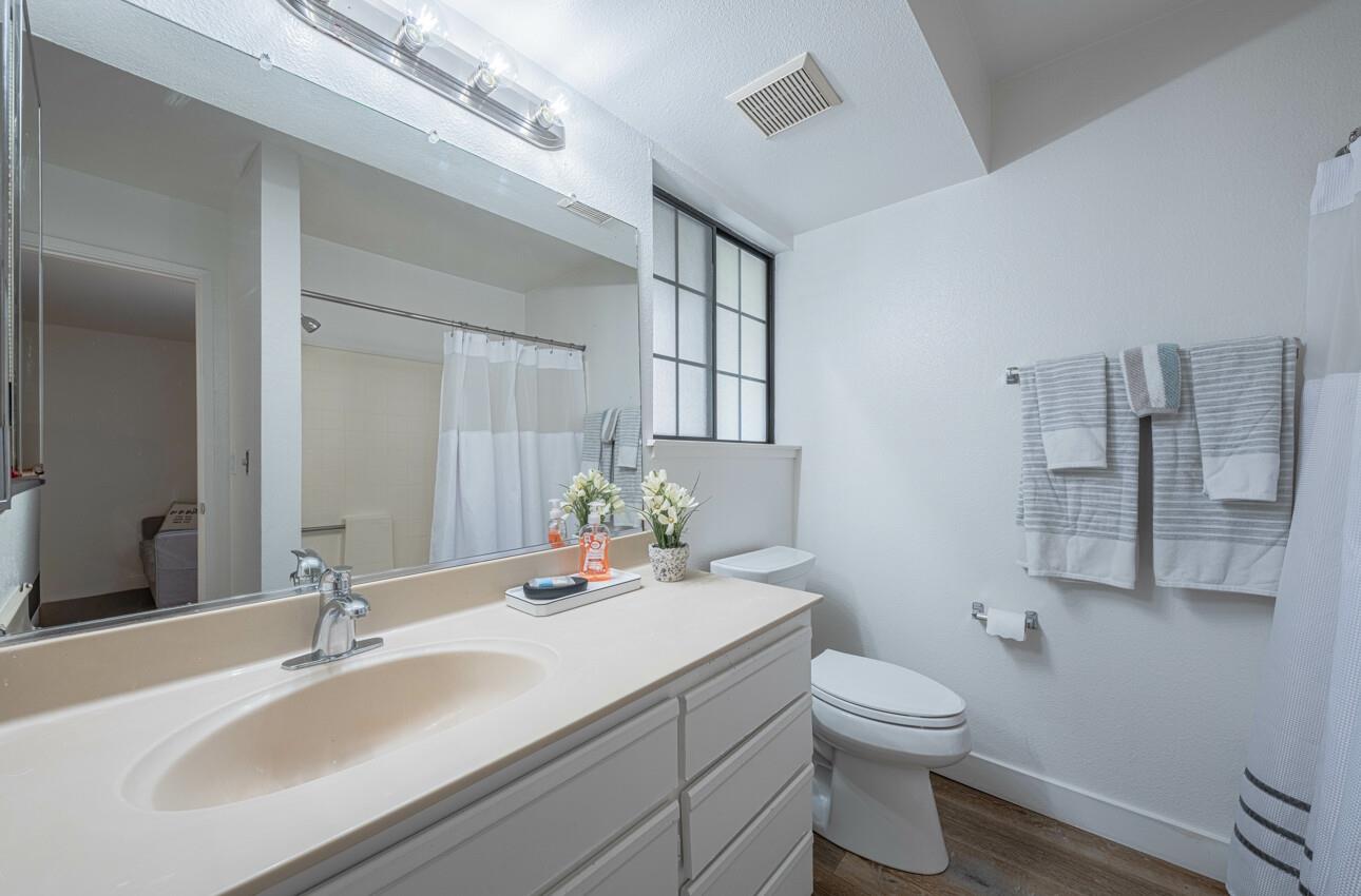 640 Pheasant Ridge Road Monterey, CA 93940 - Photo 14 of 27 a bathroom with a sink toilet and mirror