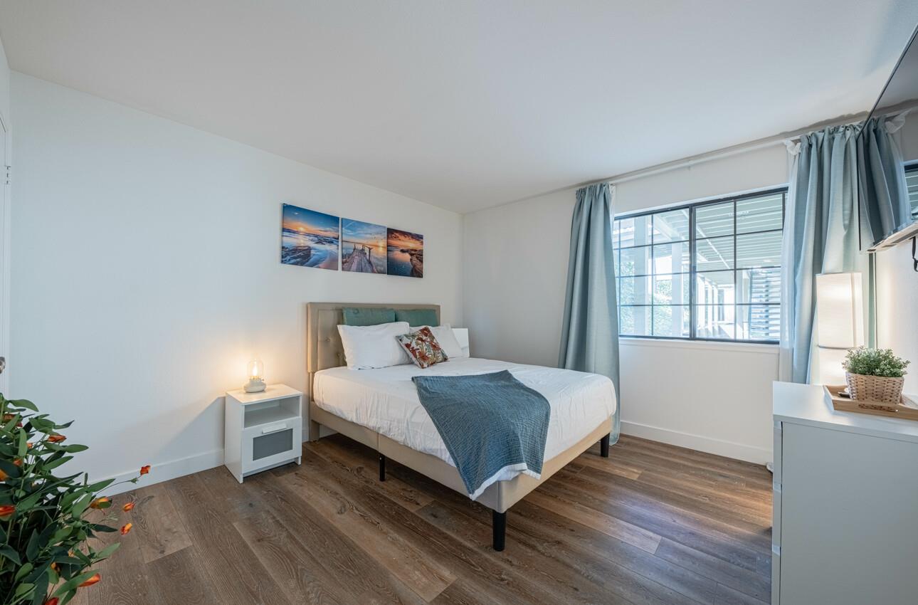 640 Pheasant Ridge Road Monterey, CA 93940 - Photo 16 of 27 a bedroom with a bed and a large window