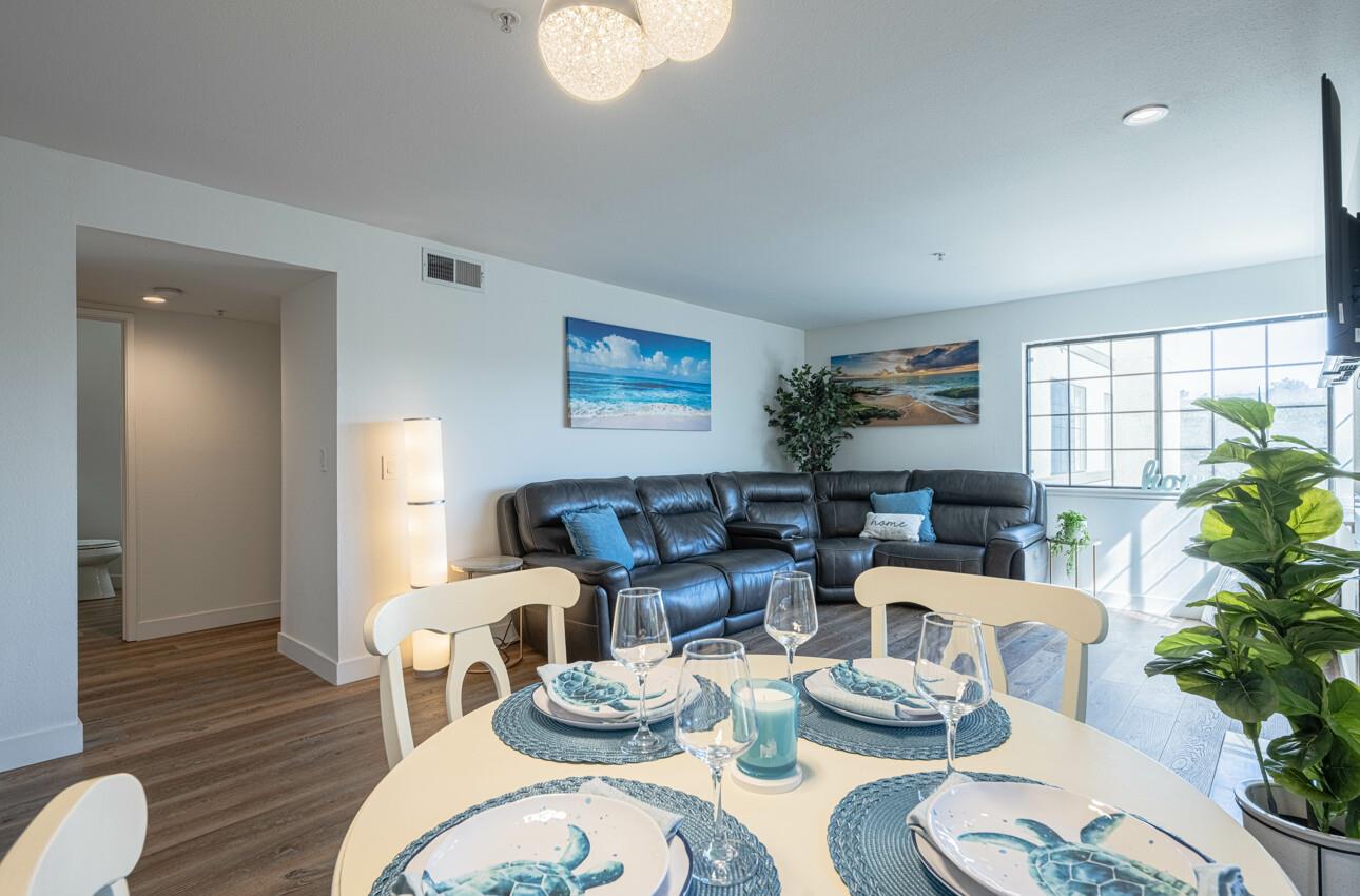 640 Pheasant Ridge Road Monterey, CA 93940 - Photo 2 of 27 a dining room with furniture a potted plant and a large window