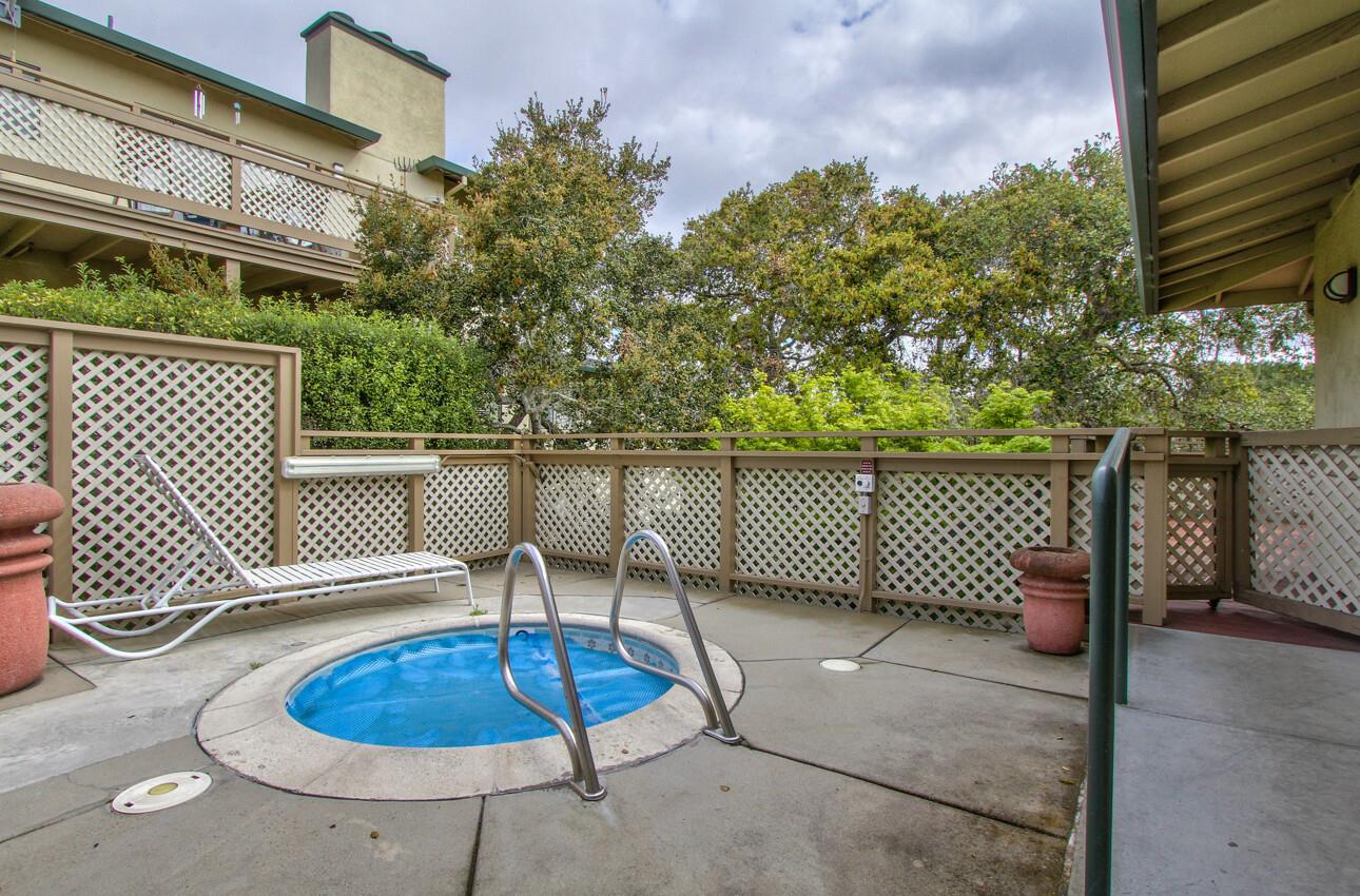 640 Pheasant Ridge Road Monterey, CA 93940 - Photo 25 of 27 a backyard of a house with table and chairs