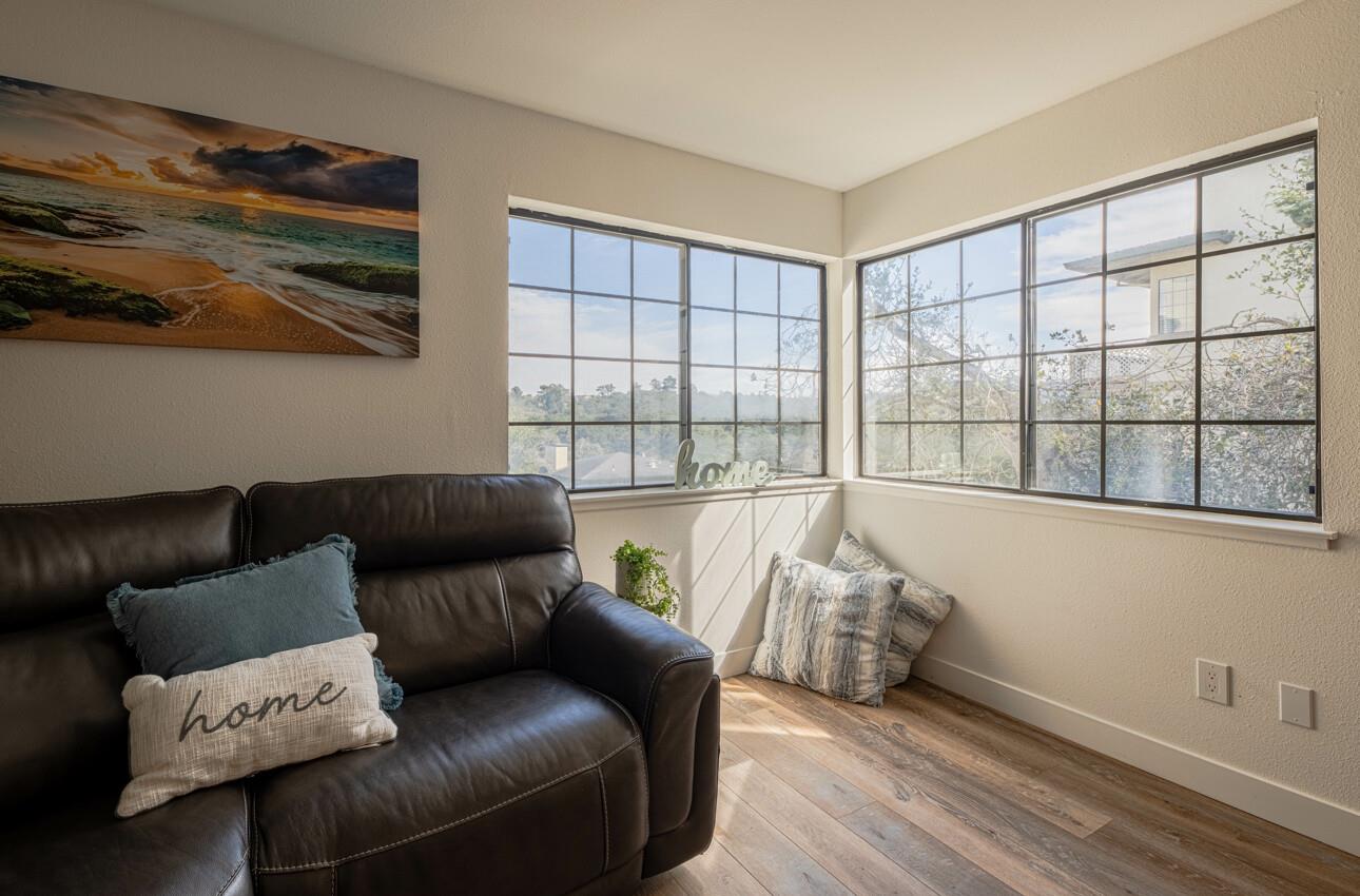 640 Pheasant Ridge Road Monterey, CA 93940 - Photo 6 of 27 a living room with furniture and a large window