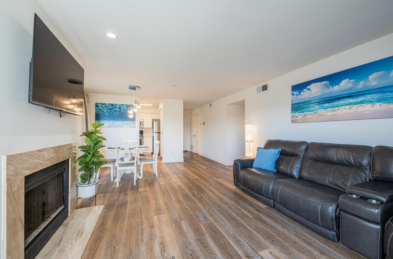 640 Pheasant Ridge Road Monterey, CA 93940 - Photo 7 of 27 a living room with furniture flat screen tv and a fireplace