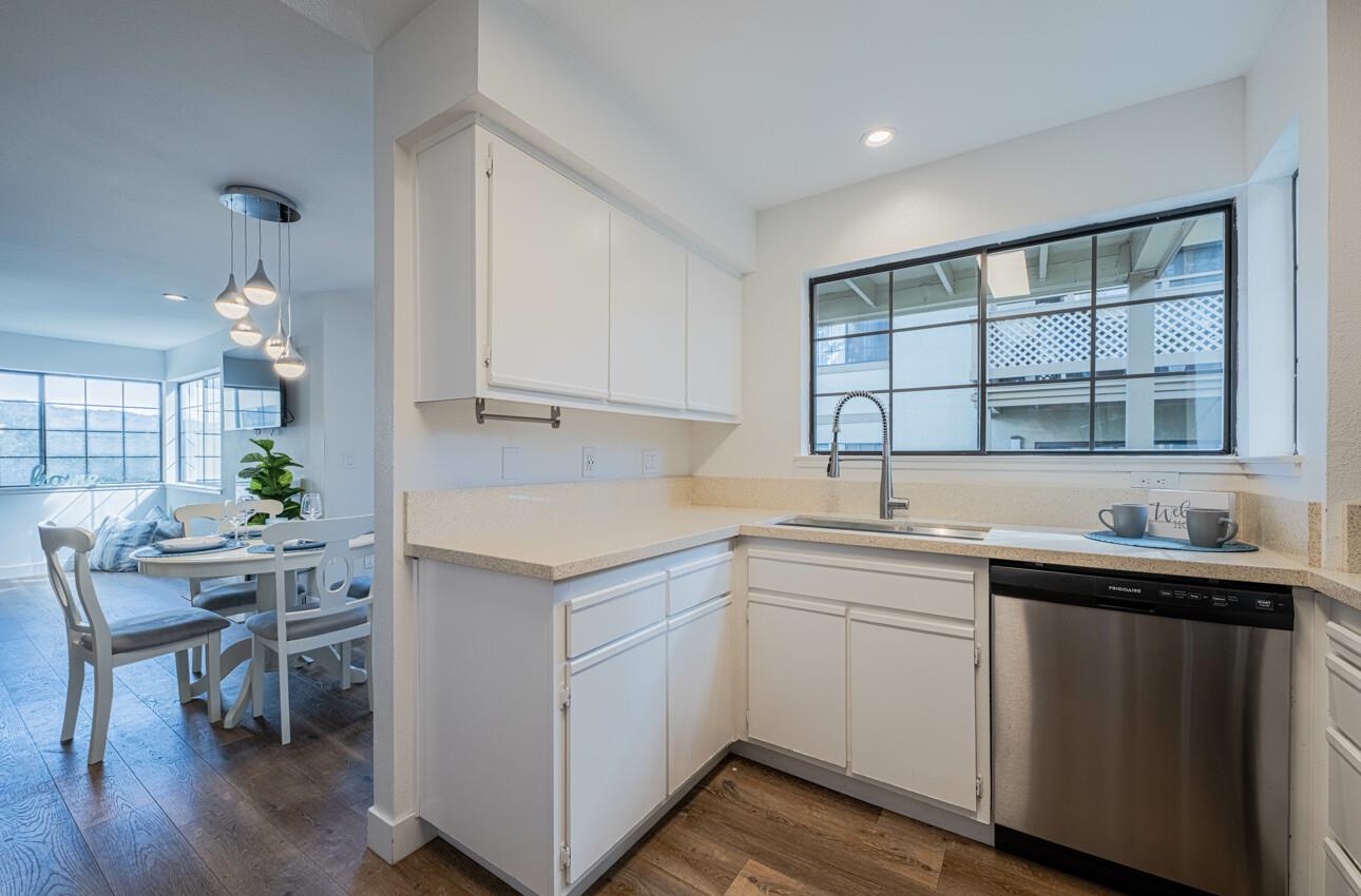 640 Pheasant Ridge Road Monterey, CA 93940 - Photo 8 of 27 a kitchen with a sink cabinets and wooden floor