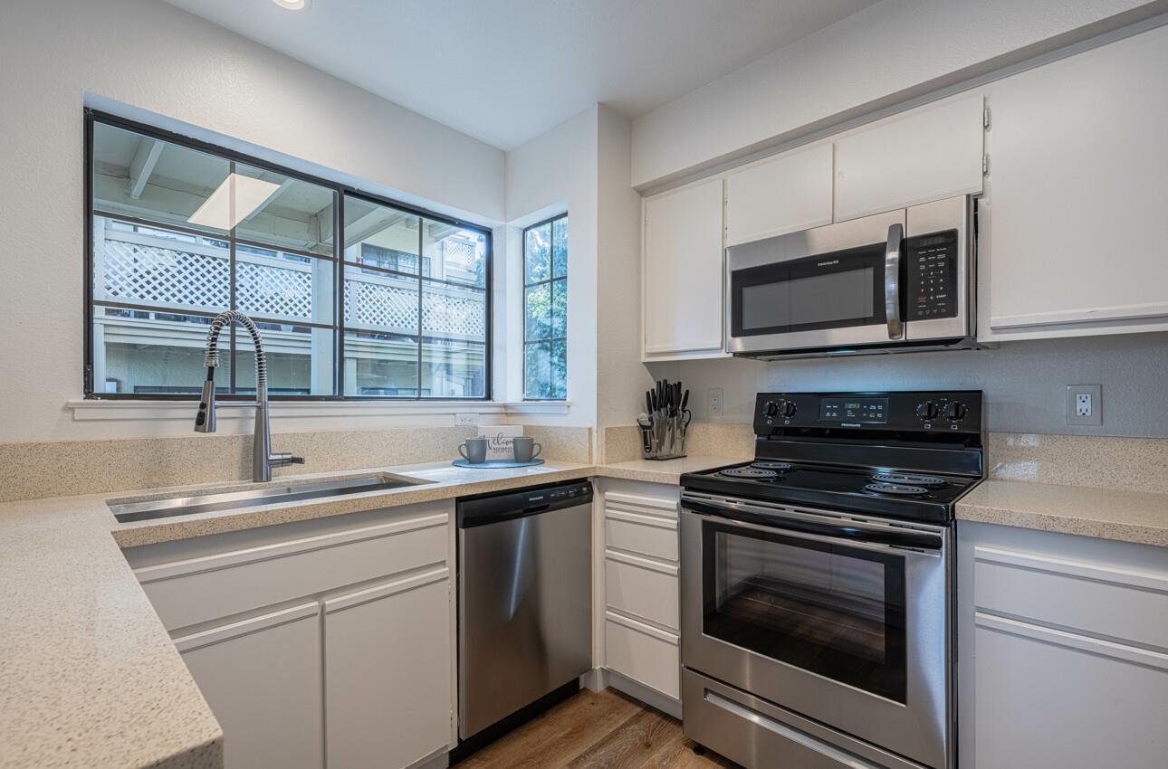 640 Pheasant Ridge Road Monterey, CA 93940 - Photo 9 of 27 a kitchen with a sink stove and microwave