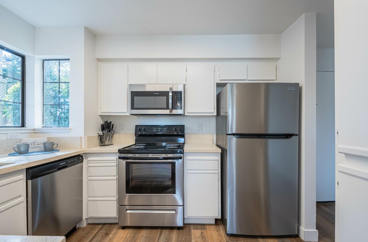 640 Pheasant Ridge Road Monterey, CA 93940 - Photo 10 of 27 a kitchen with a refrigerator sink and stove