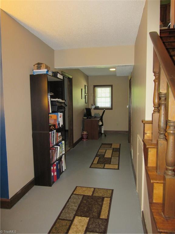 157 Old Farm Road Thomasville, NC 27360 - Photo 19 of 30 Wide hallway in the basement