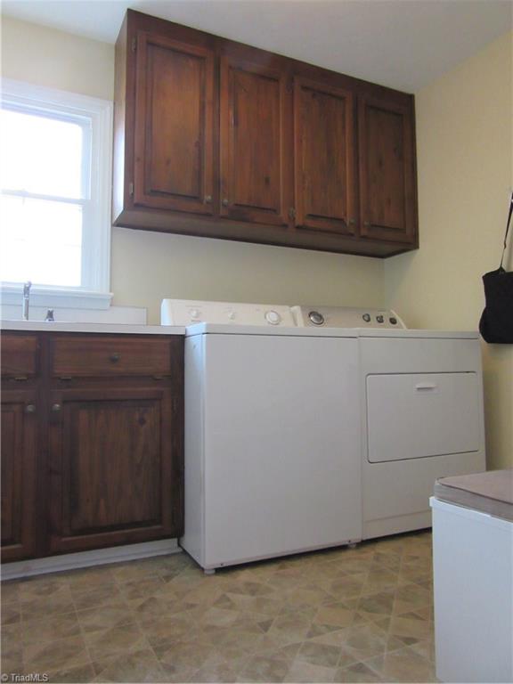 157 Old Farm Road Thomasville, NC 27360 - Photo 25 of 30 Main level laundry includes a large pantry, cabinets, sink, etc.