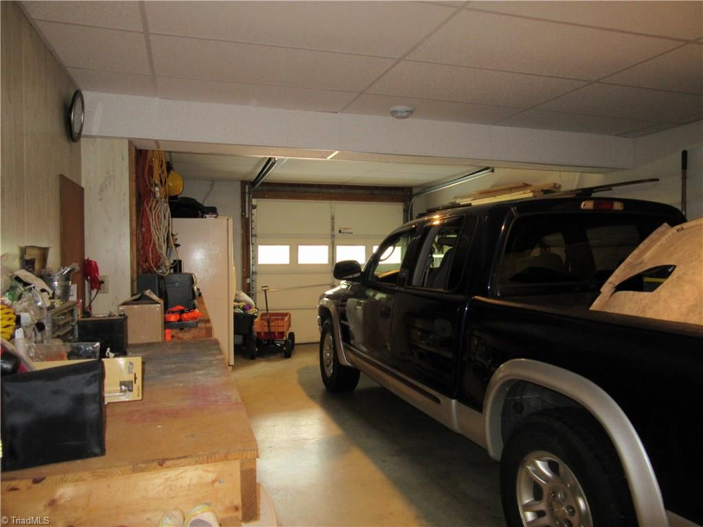 157 Old Farm Road Thomasville, NC 27360 - Photo 26 of 30 For those that love to tinker, the basement level garage is heated and cooled! Drop ceiling was added in Aug. 2016.