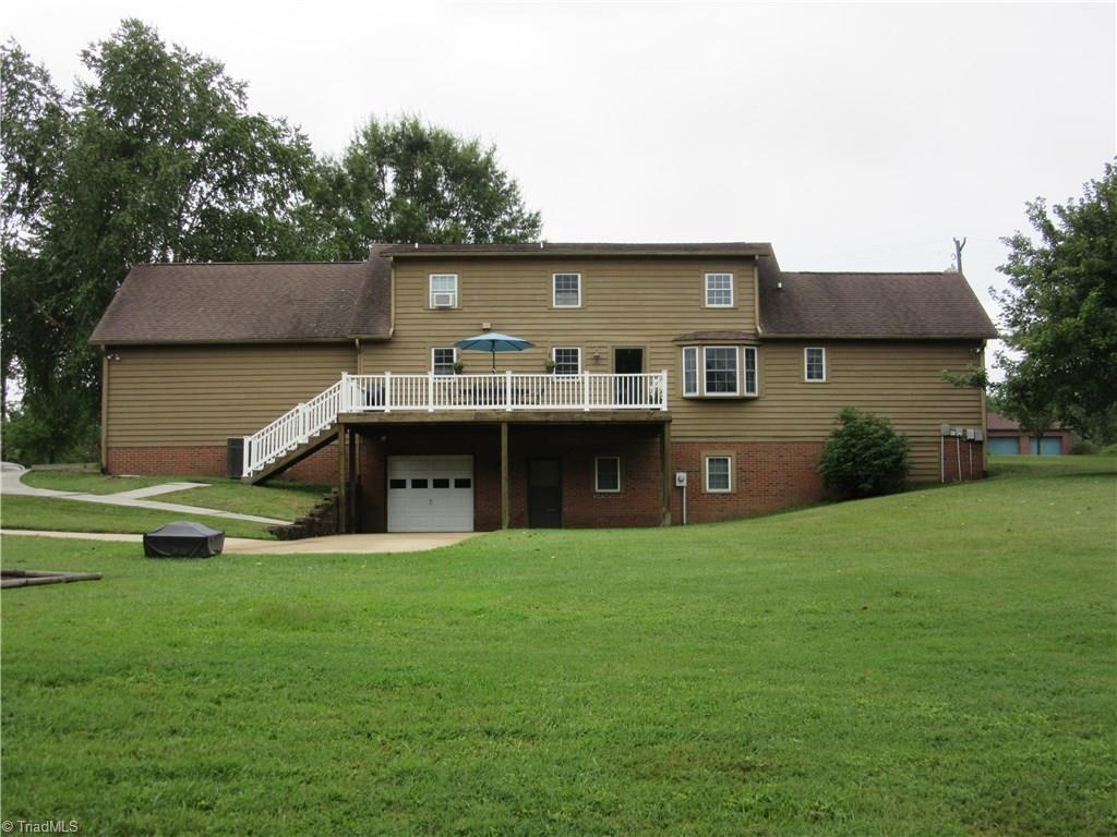 157 Old Farm Road Thomasville, NC 27360 - Photo 27 of 30 Great view of the back of the house and the backyard + the underground fence system for your pet remains!