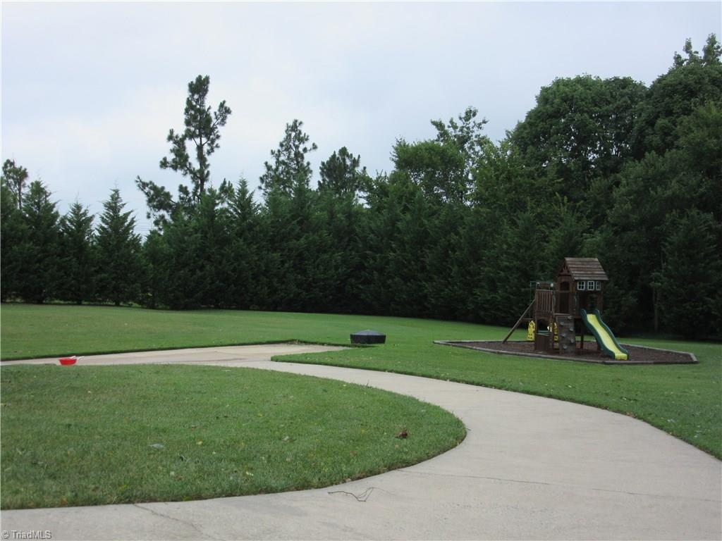 157 Old Farm Road Thomasville, NC 27360 - Photo 29 of 30 The Paved drive leads to the 3rd garage space/workshop area.