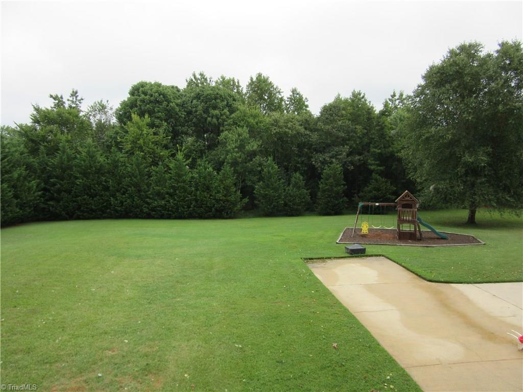 157 Old Farm Road Thomasville, NC 27360 - Photo 30 of 30 Lush, private and expansive describe this level backyard!