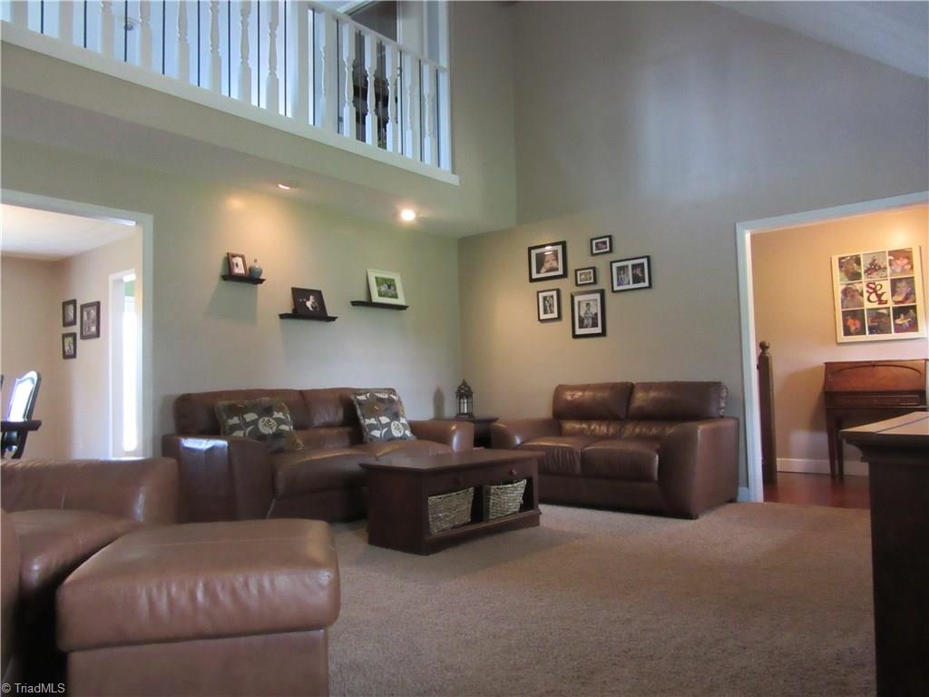 157 Old Farm Road Thomasville, NC 27360 - Photo 7 of 30 Fresh paint and the open loft concept allow for light to pour into this space!