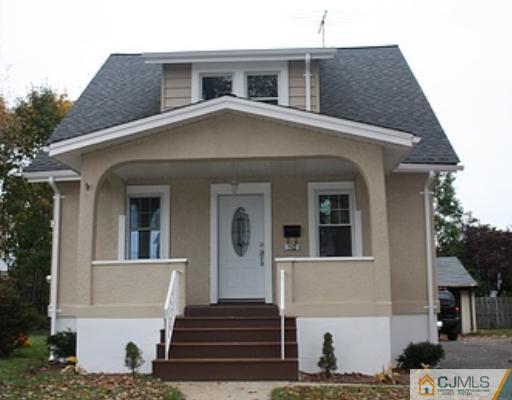 110 Parker Street Middlesex, NJ 08846 - Photo 1 of 8 a front view of a house with a yard