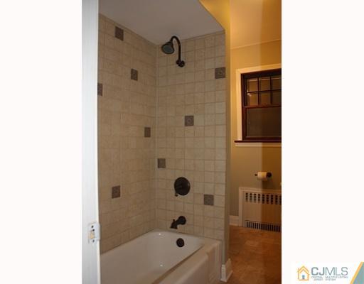 110 Parker Street Middlesex, NJ 08846 - Photo 5 of 8 a bathroom with a bathtub and shower