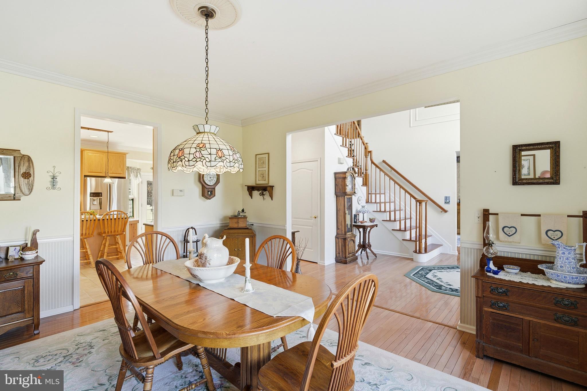 27 Rodeo Drive West Creek, NJ 08092 - Photo 15 of 52 a dining room with furniture a chandelier and wooden floor