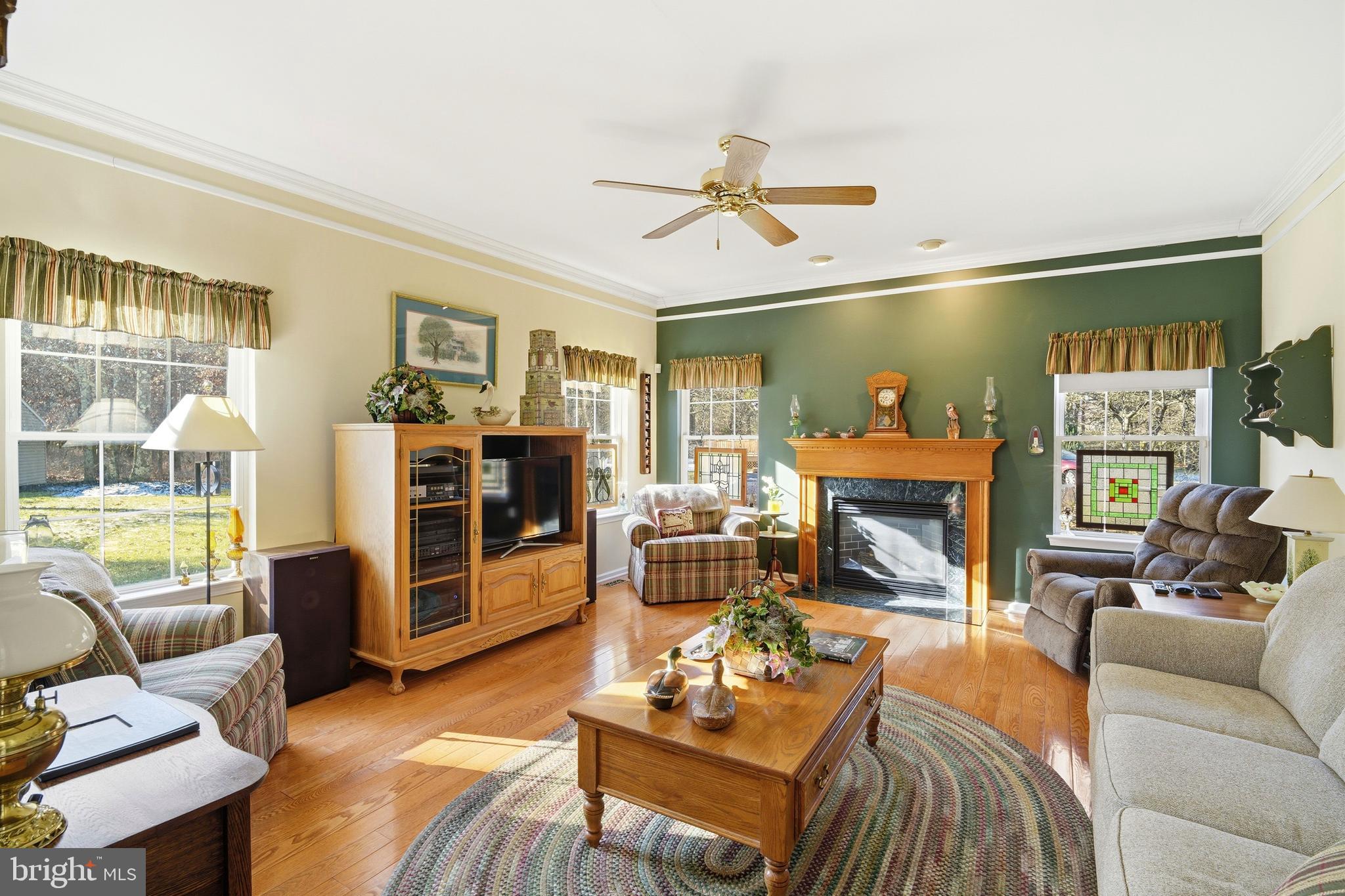 27 Rodeo Drive West Creek, NJ 08092 - Photo 24 of 52 a living room with furniture and a fireplace