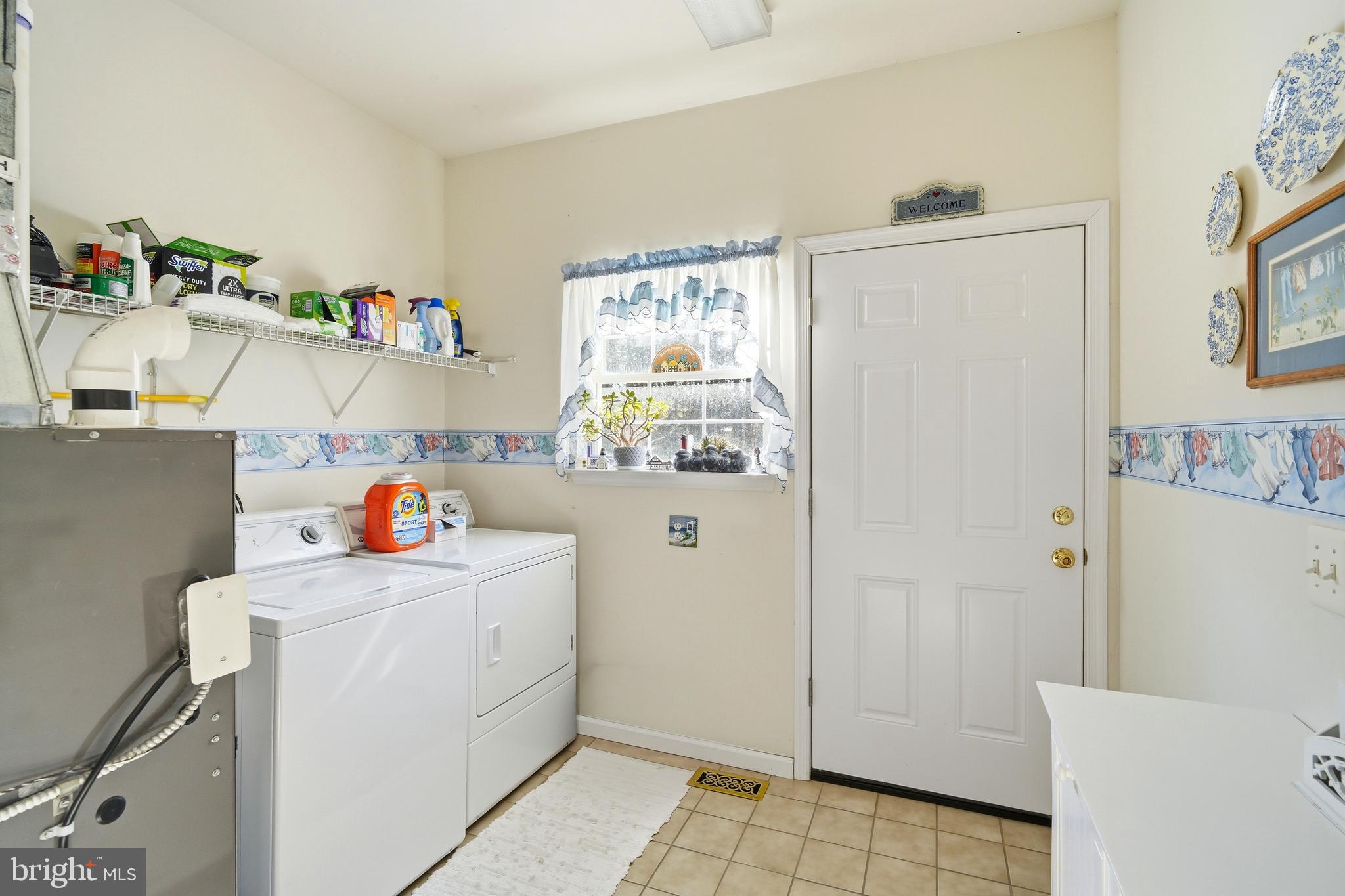 27 Rodeo Drive West Creek, NJ 08092 - Photo 26 of 52 a storage room with a fridge and wooden floor