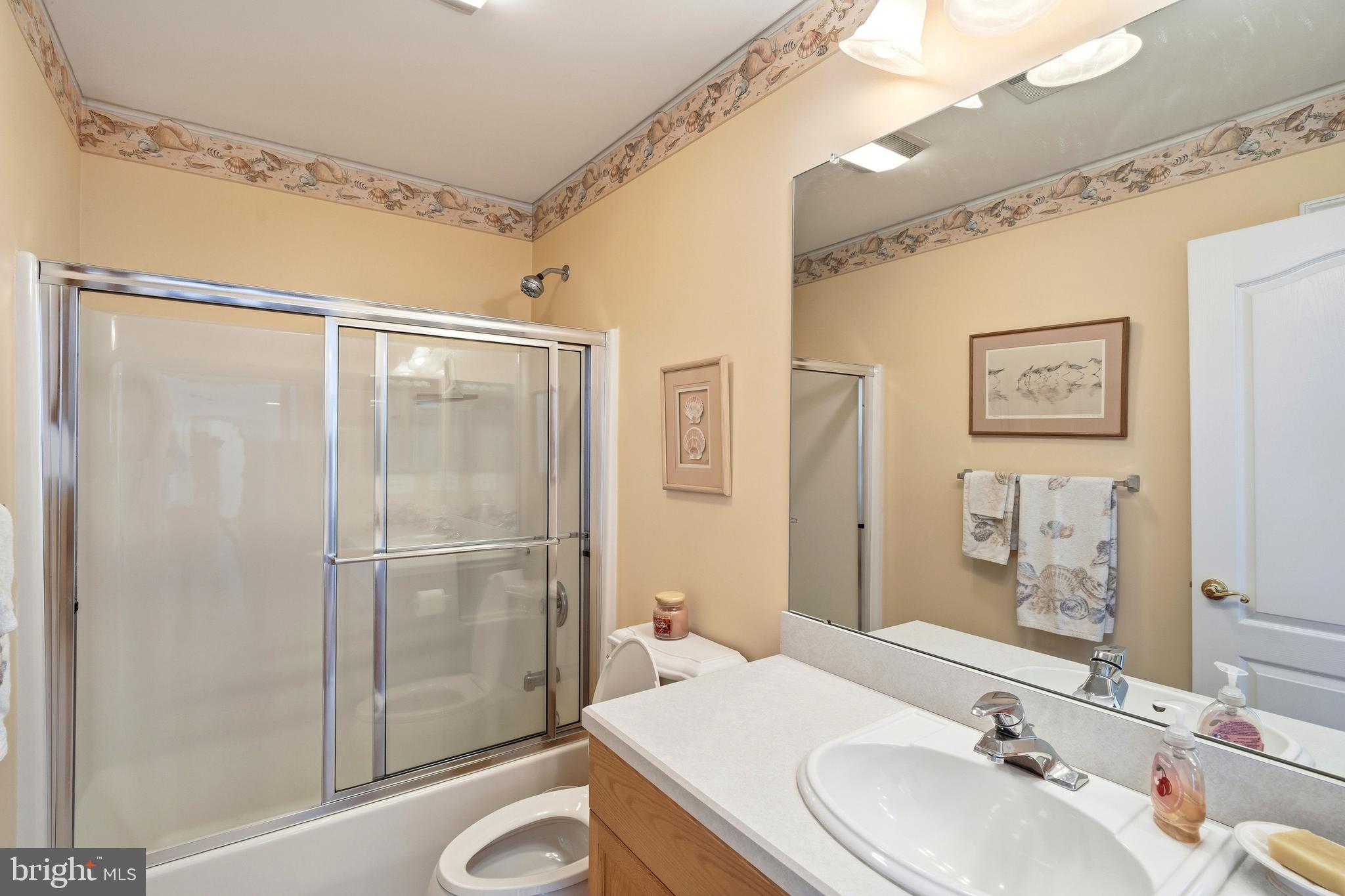 27 Rodeo Drive West Creek, NJ 08092 - Photo 31 of 52 a bathroom with a sink and a mirror