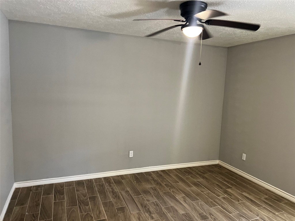 2375 Virginia Court, Unit B Montgomery, TX 77316 - Photo 6 of 13 a view of an empty room with a chandelier fan