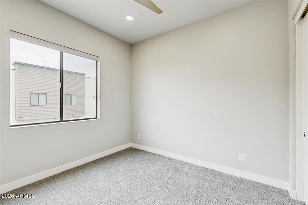 2645 East Osborn Road, Unit 3 Phoenix, AZ 85016 - Photo 12 of 14 an empty room with windows