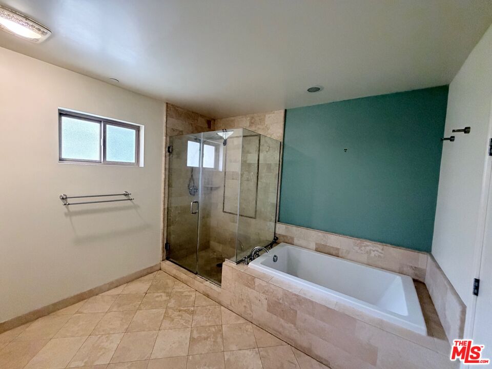 8238 West Manchester Avenue, Unit 308 Playa del Rey, CA 90293 - Photo 11 of 19 a bathroom with a bathtub and shower