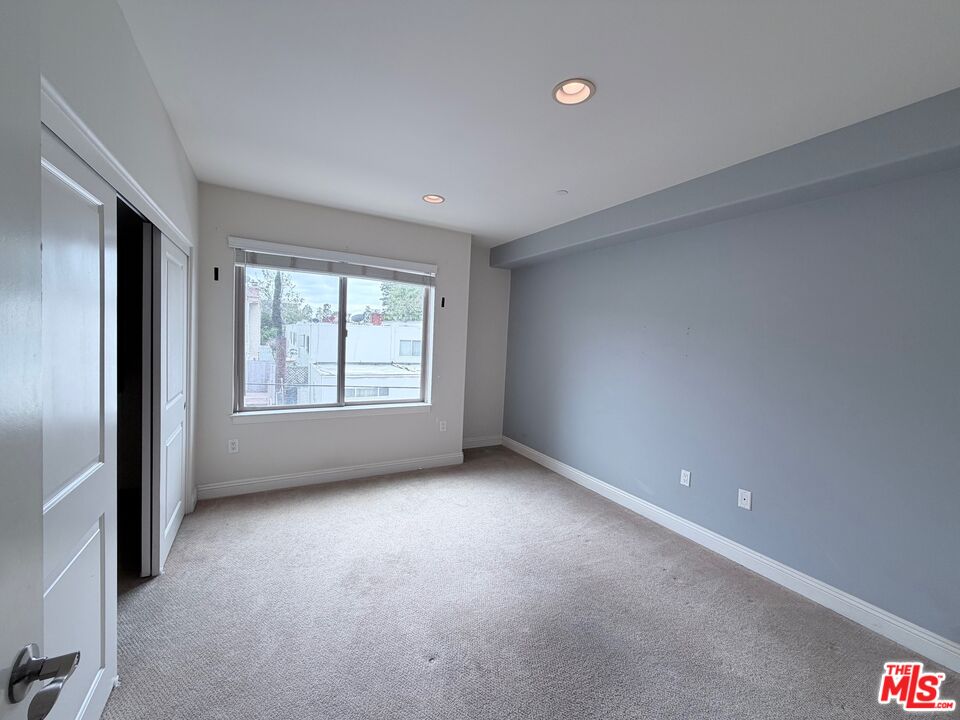8238 West Manchester Avenue, Unit 308 Playa del Rey, CA 90293 - Photo 15 of 19 an empty room with windows
