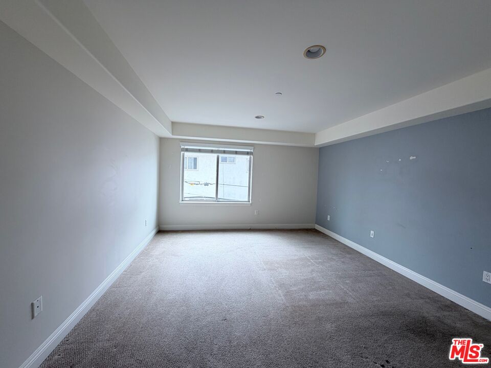 8238 West Manchester Avenue, Unit 308 Playa del Rey, CA 90293 - Photo 9 of 19 an empty room with windows
