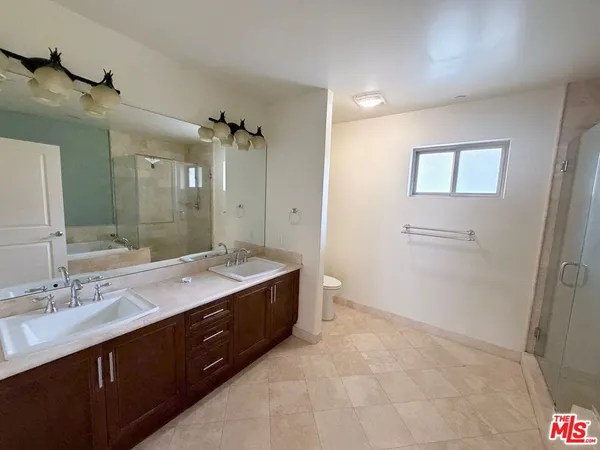 a bathroom with a bathtub and shower