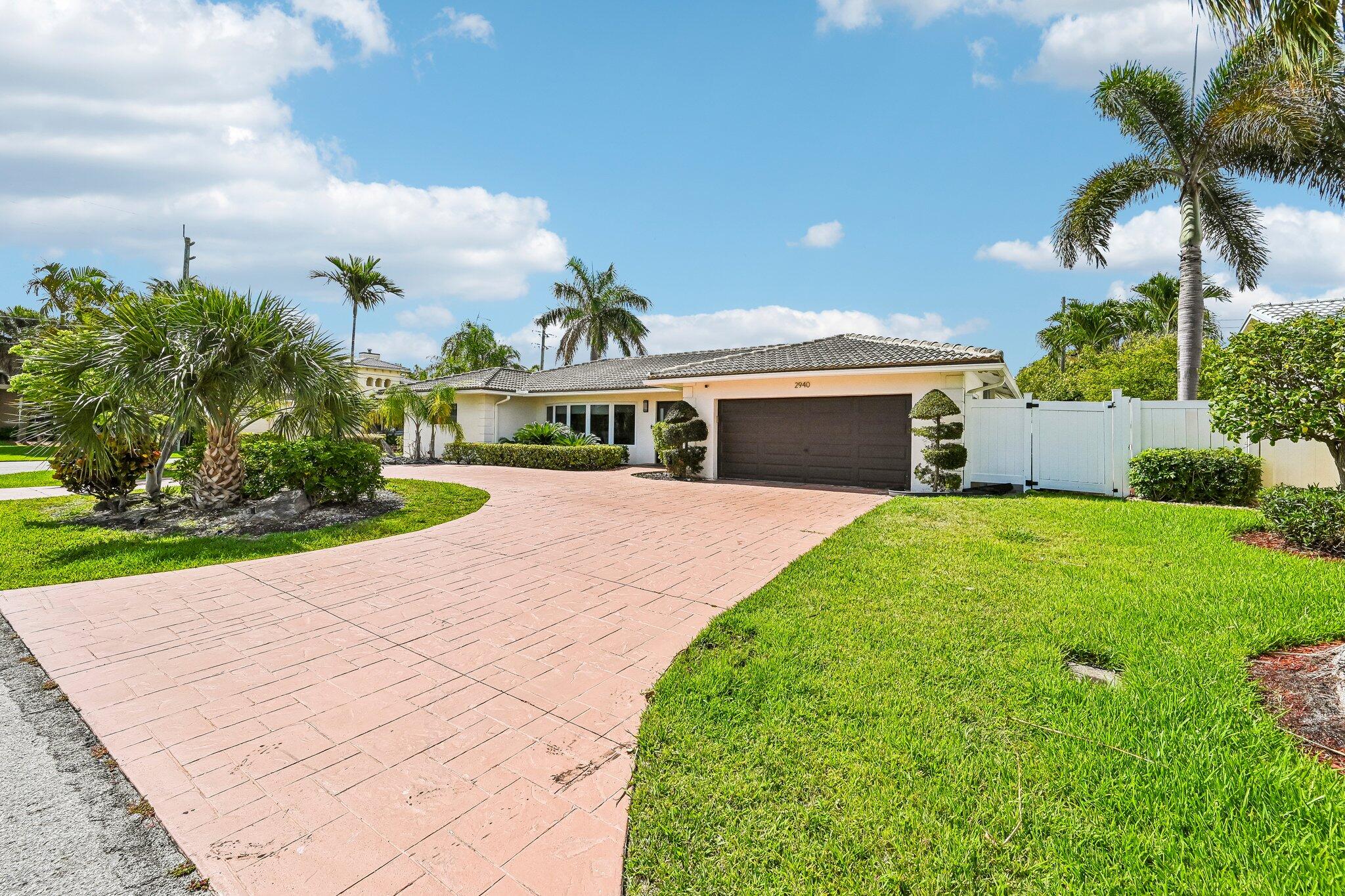 2940 Northeast 39th Court Lighthouse Point, FL 33064 - Photo 34 of 42 a view of a house with a yard