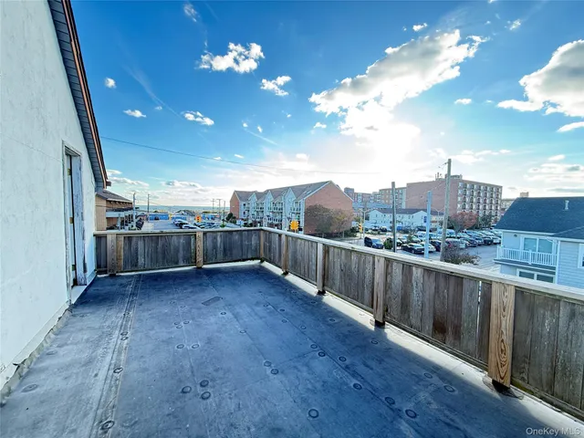 a view of city with wooden floor and city view