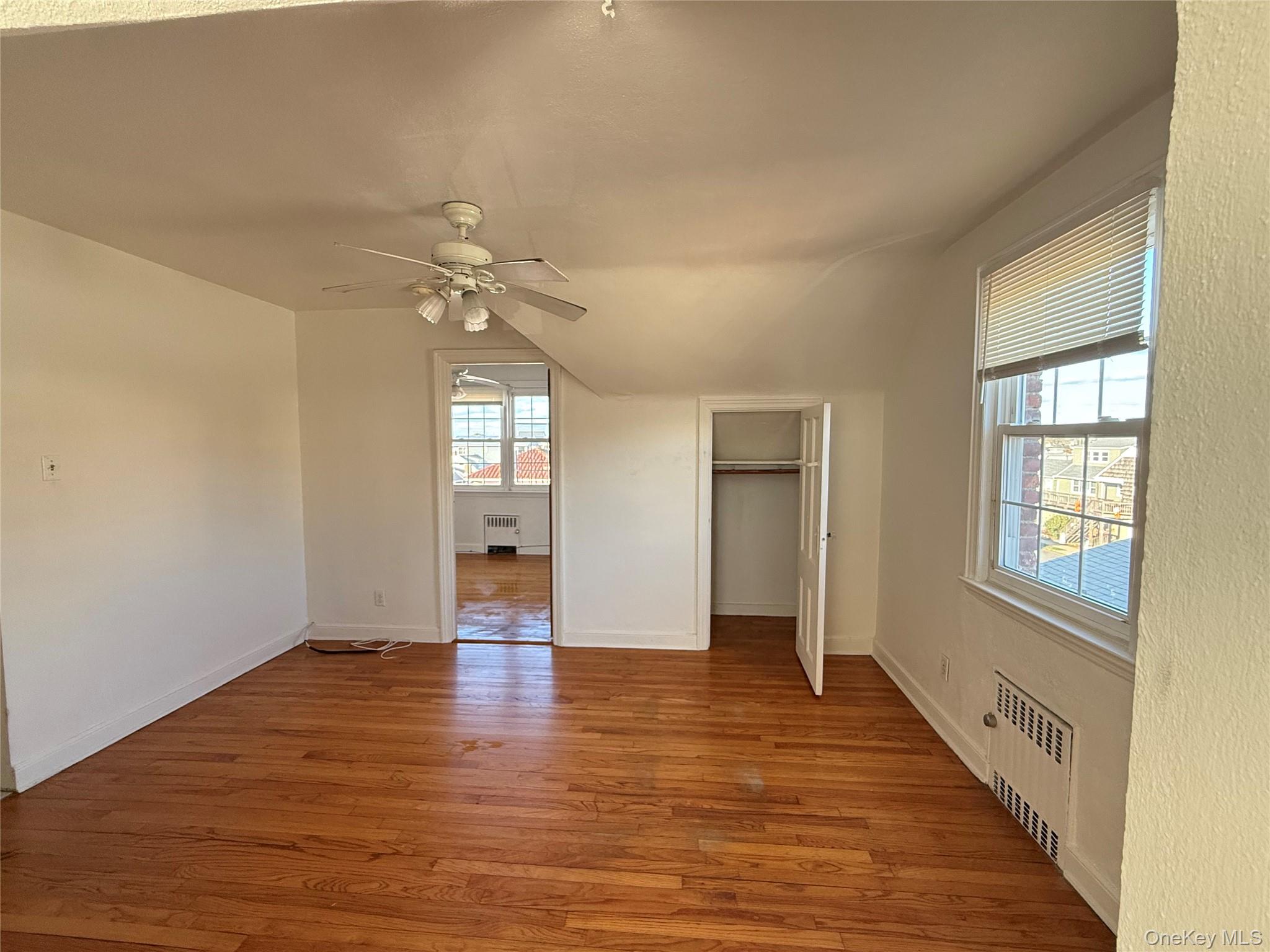 801 East Broadway, Unit F Long Beach, NY 11561 - Photo 6 of 11 wooden floor in an empty room with a window