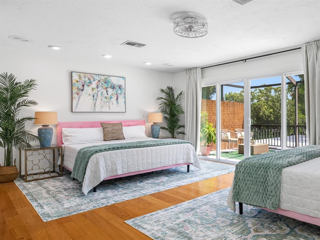 2153 Karan Way Clearwater, FL 33763 - Photo 29 of 65 a spacious bedroom with a large bed and a couch