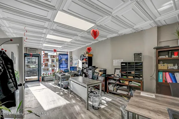 a bathroom with a toilet and a shower curtain