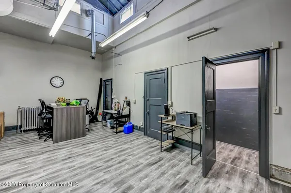 a bed room with a bed and a mirror