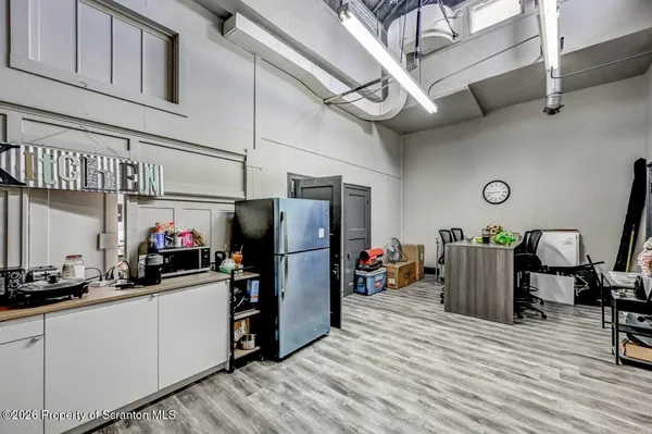 a view of a workspace with furniture and toys