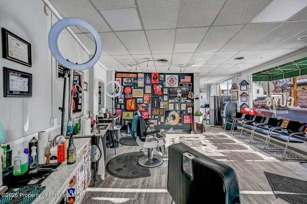 a bathroom with a sink toilet and a mirror