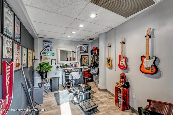 a bathroom with a granite countertop toilet a sink and a mirror