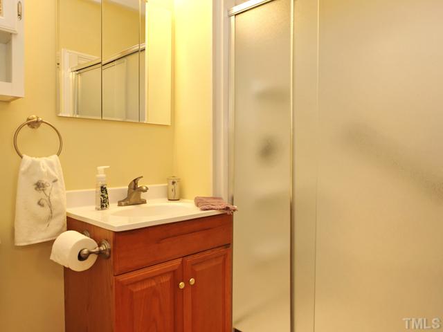 12333 Whartons Way Raleigh, NC 27613 - Photo 24 of 25 Downstairs bath with walk in shower