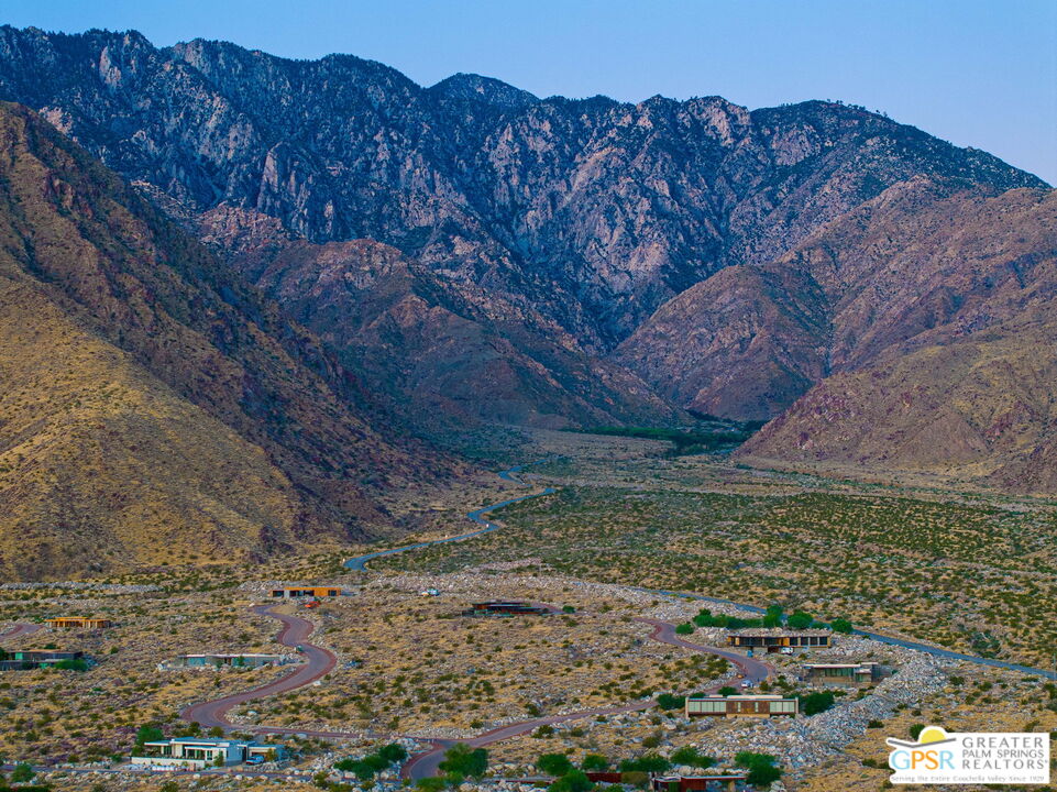 2405 Rising Sun Court Palm Springs, CA 92262 - Photo 7 of 14 a view of a backyard with wooden fence