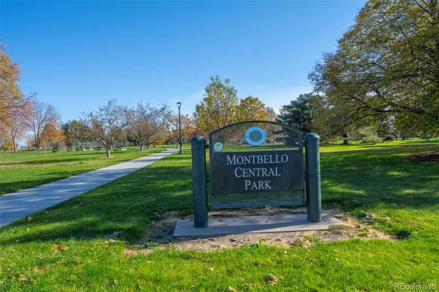a sign board with a park view
