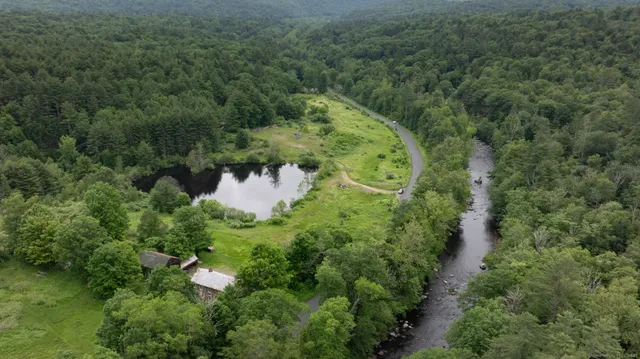 an aerial view of a house with a yard