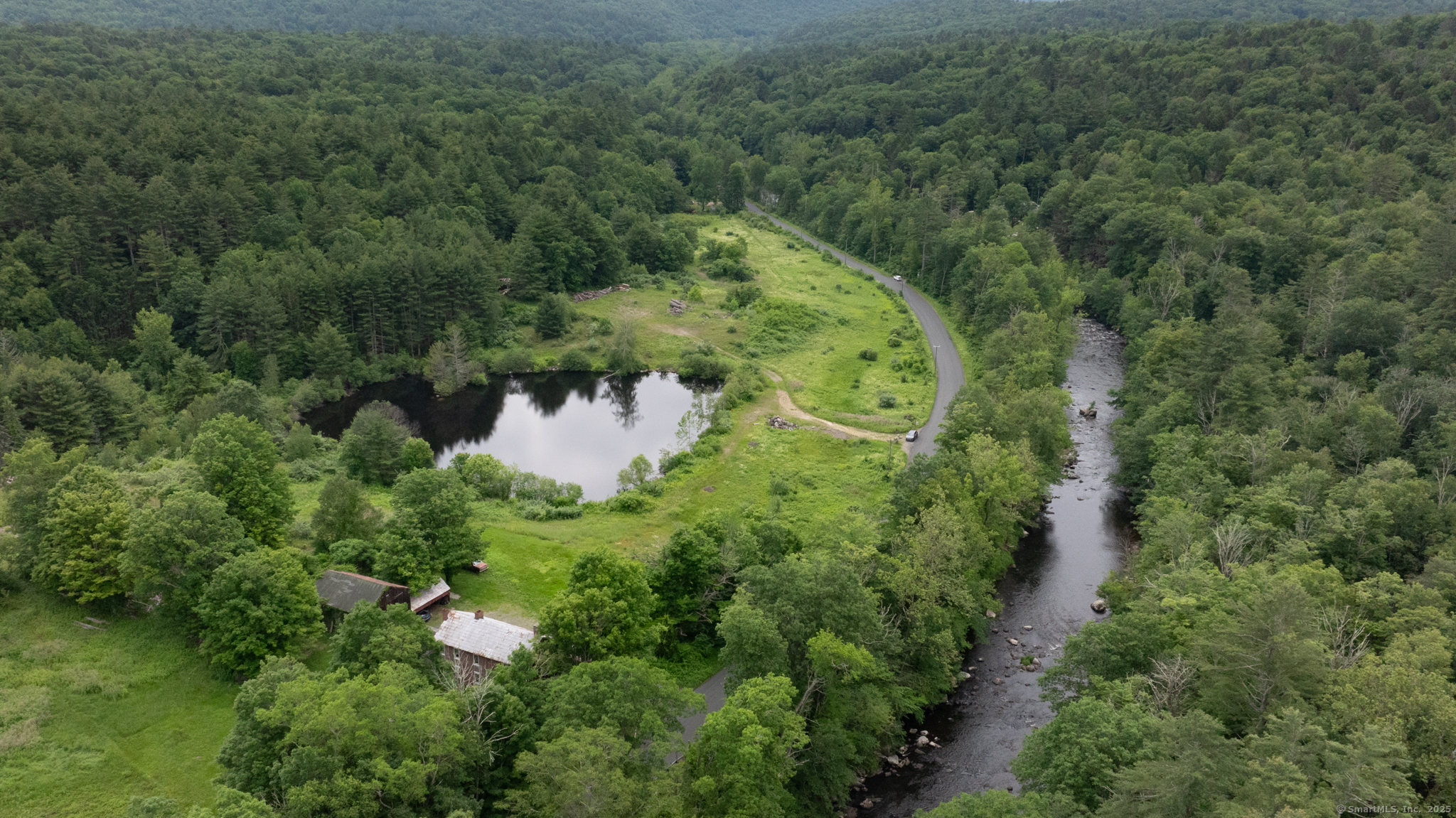 82 Riverton Road Colebrook, CT 06021 - Photo 6 of 9 an aerial view of a house with a yard