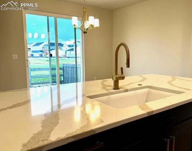 a bathroom with a sink and a large mirror