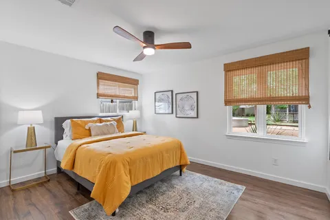 a bedroom with a bed and a window