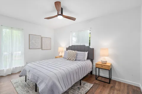 a bedroom with a bed and a lamp