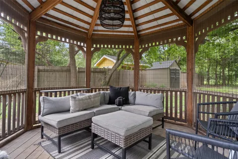 a view of a patio with a table and chairs
