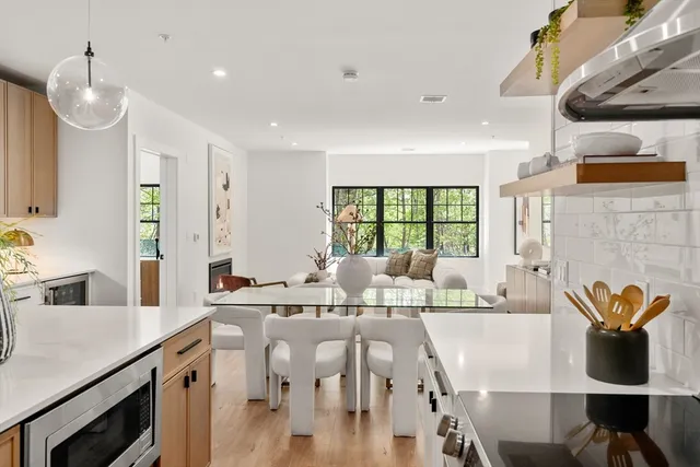 a very nice looking dining room with a large window