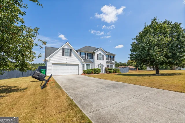 a house with trees in the background